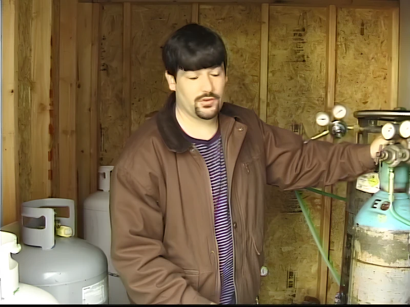 Beginner borosilicate glass blowing torch setup with oxygen propane regulators and safety equipment
